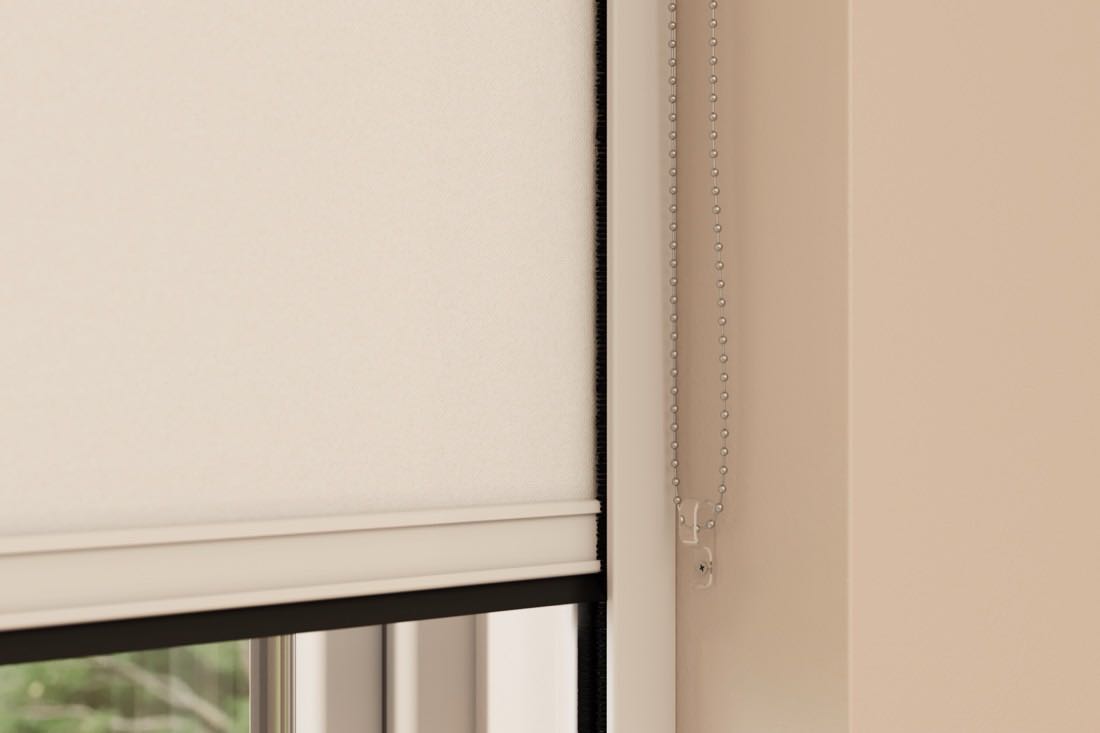 A parent measuring the width of a nursery window with a tape measure